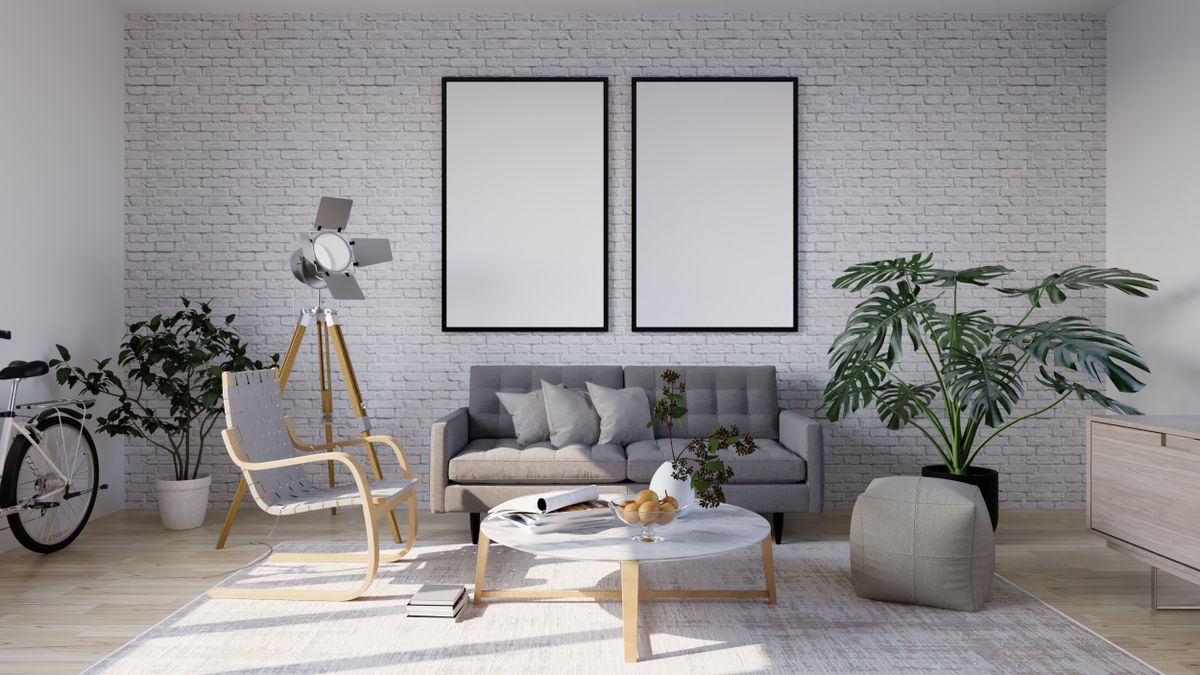 Skandinavisch inspiriertes Wohnzimmer mit minimalistischer Möblierung und Pflanzen
